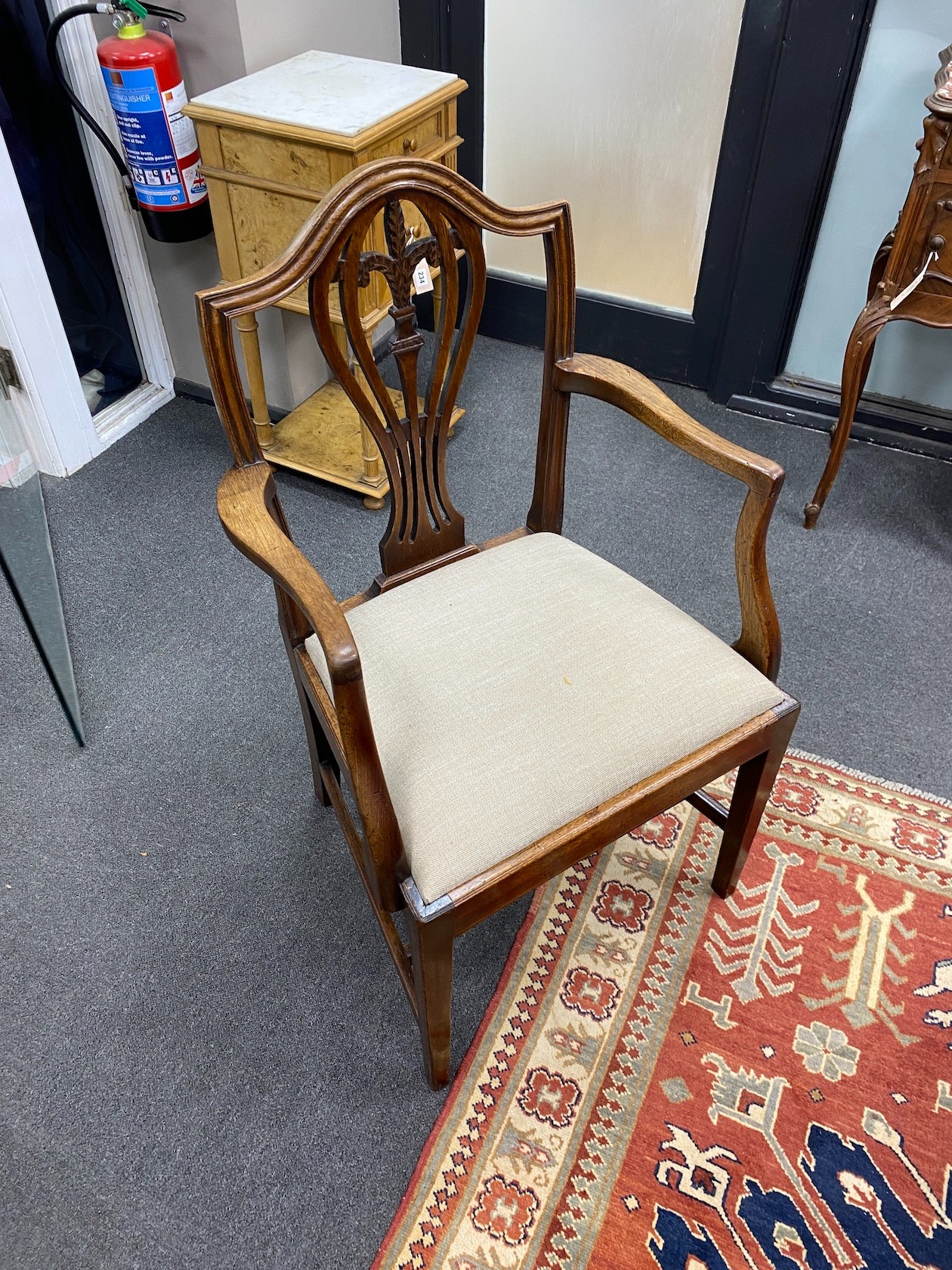 A late Victorian mahogany extending dining table, length 209cm extended with two spare leaves and winder, depth 106cm, height 76cm together with a set of eight Hepplewhite style dining chairs, two with arms